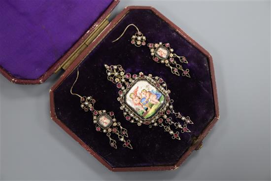 A 19th century Austro-Hungarian gilt metal, enamel, garnet and seed pearl set drop pendant brooch and pair of matching earrings.